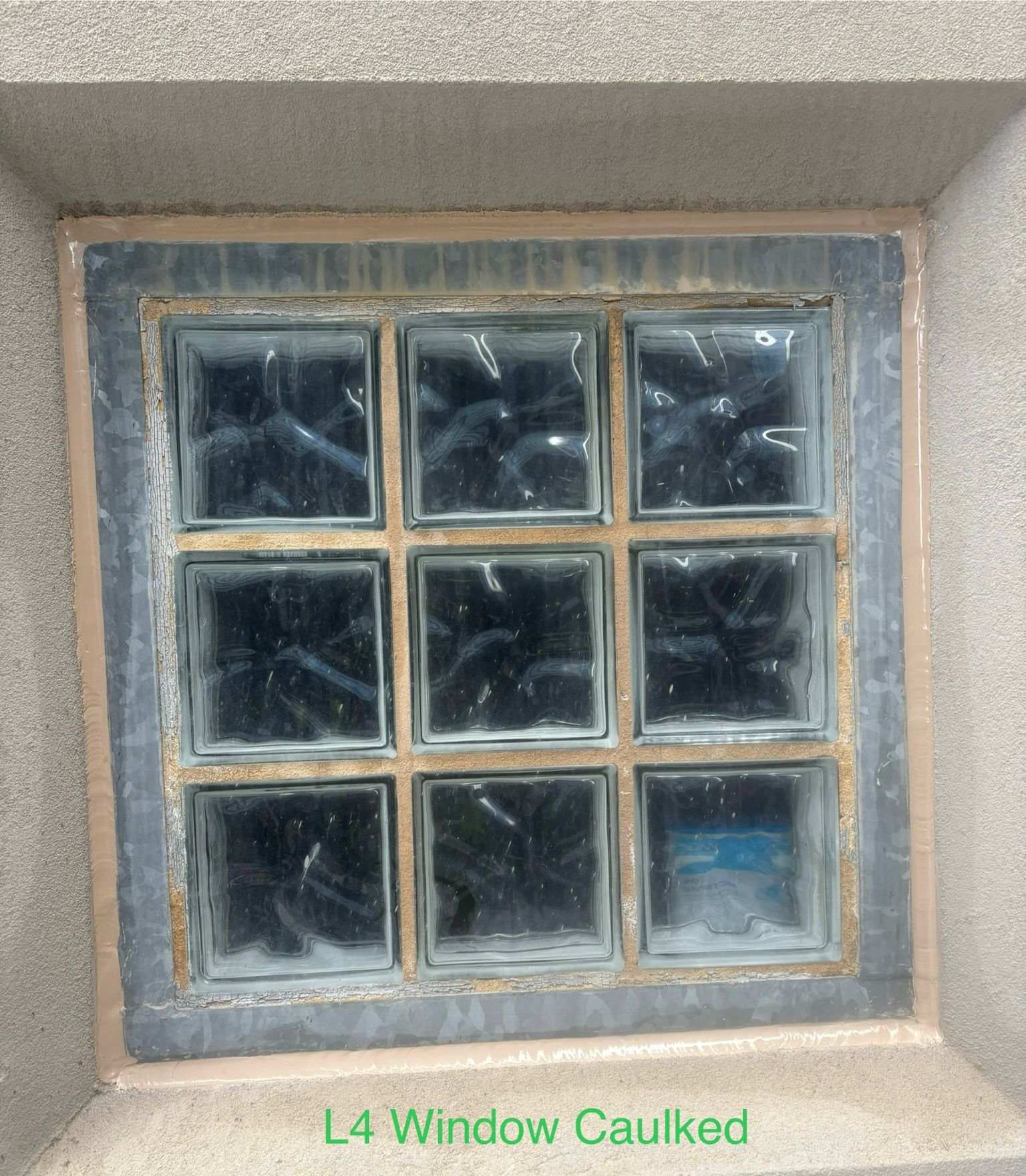 Recaulked glass block window perimeter Melbourne, fresh tooled bead