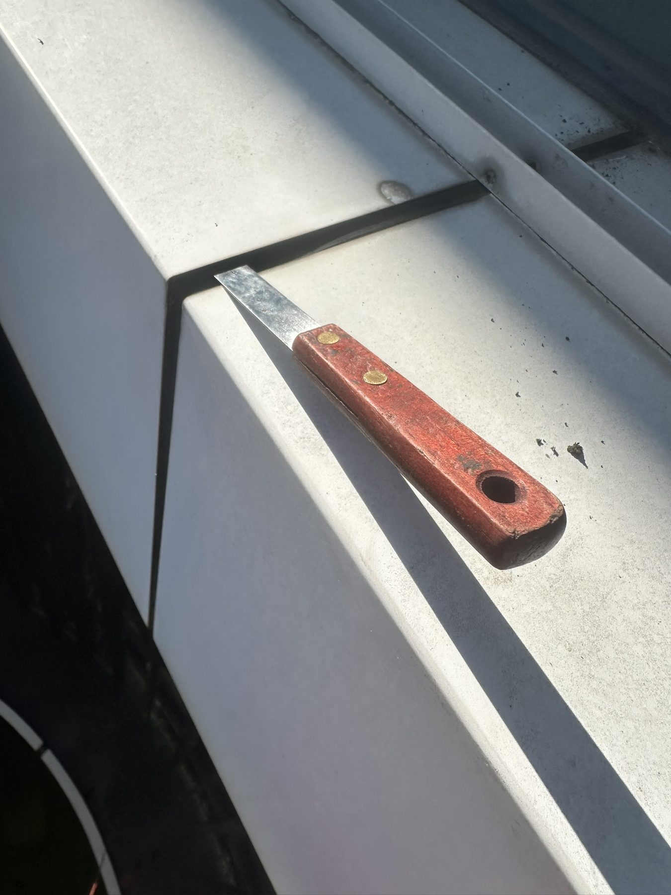 Failed sealant pulled out of panel joints exposing holes, before recaulking Melbourne