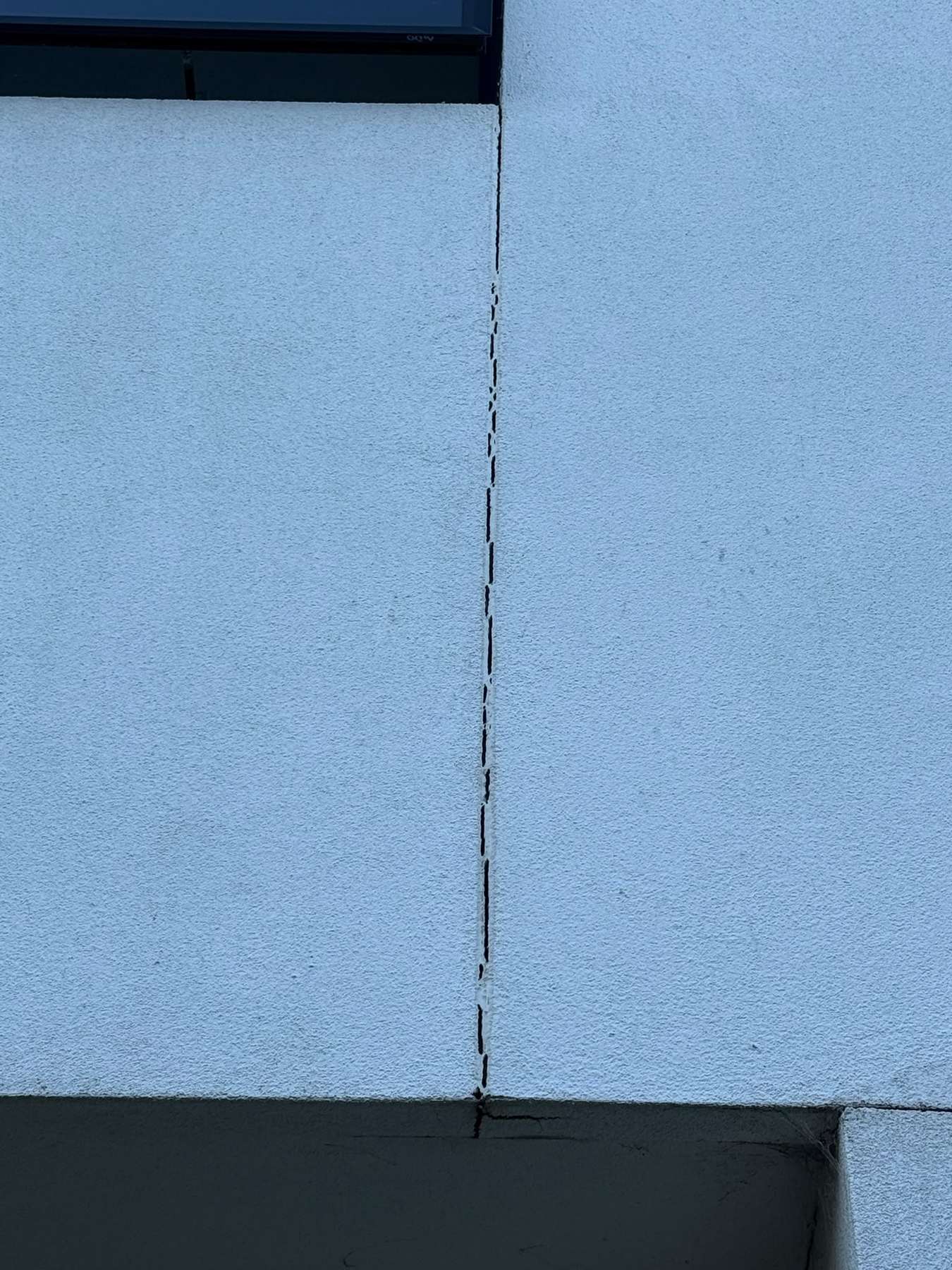 Failed perished caulking joint on commercial building facade Melbourne