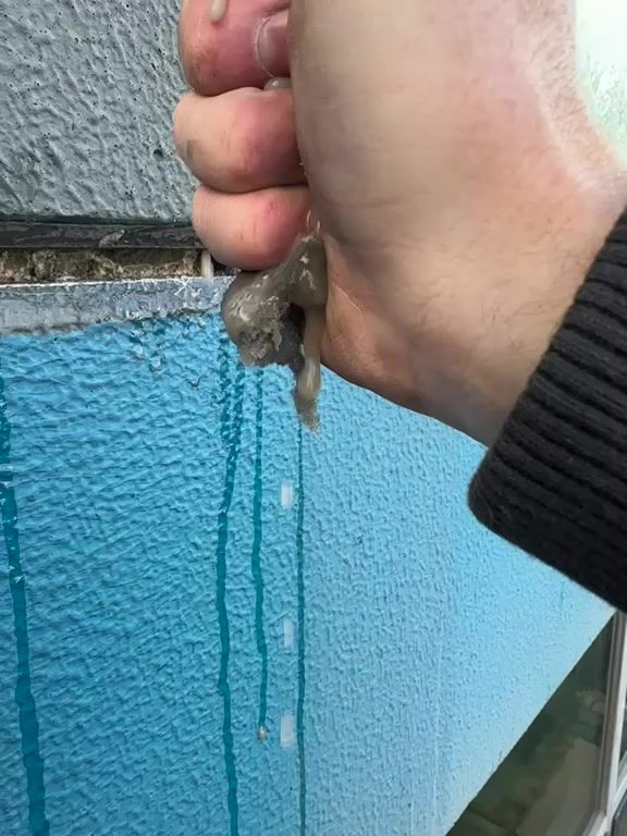 Water squeezed out of saturated failed caulking joint Melbourne