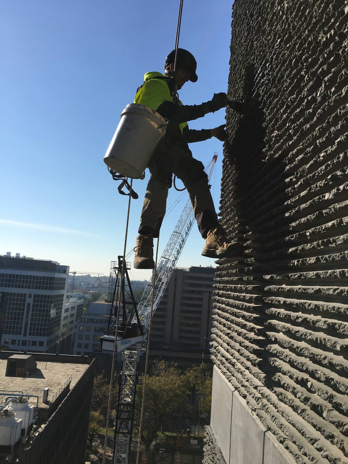 Textured concrete facade repairs rope access