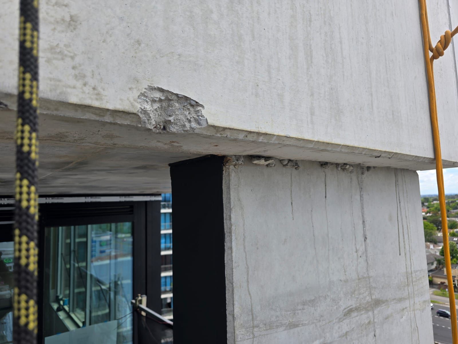 Spalled concrete at slab edge on Melbourne apartment building, concrete cancer