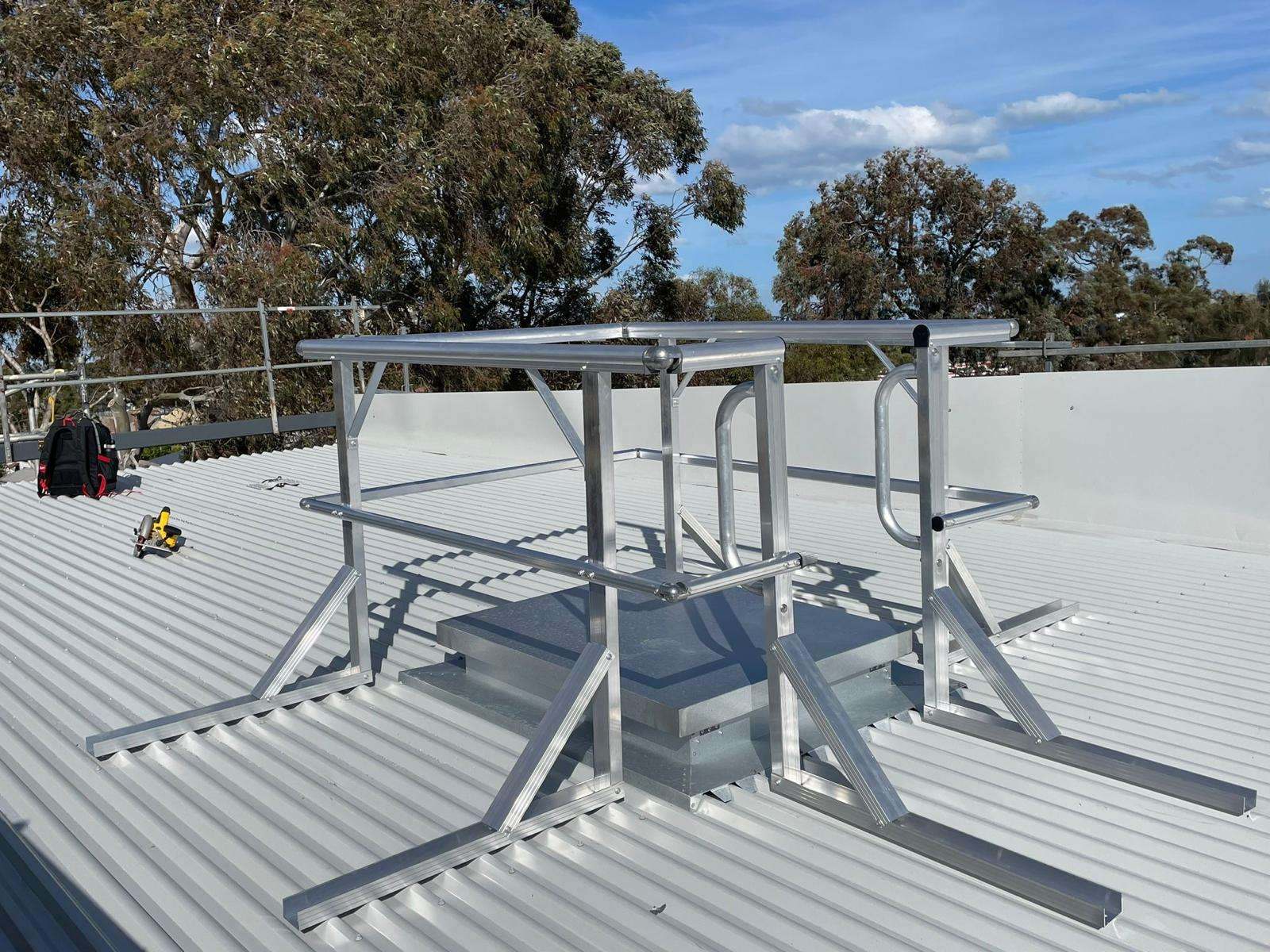 Roof hatch guardrail system installation Melbourne on commercial metal roof