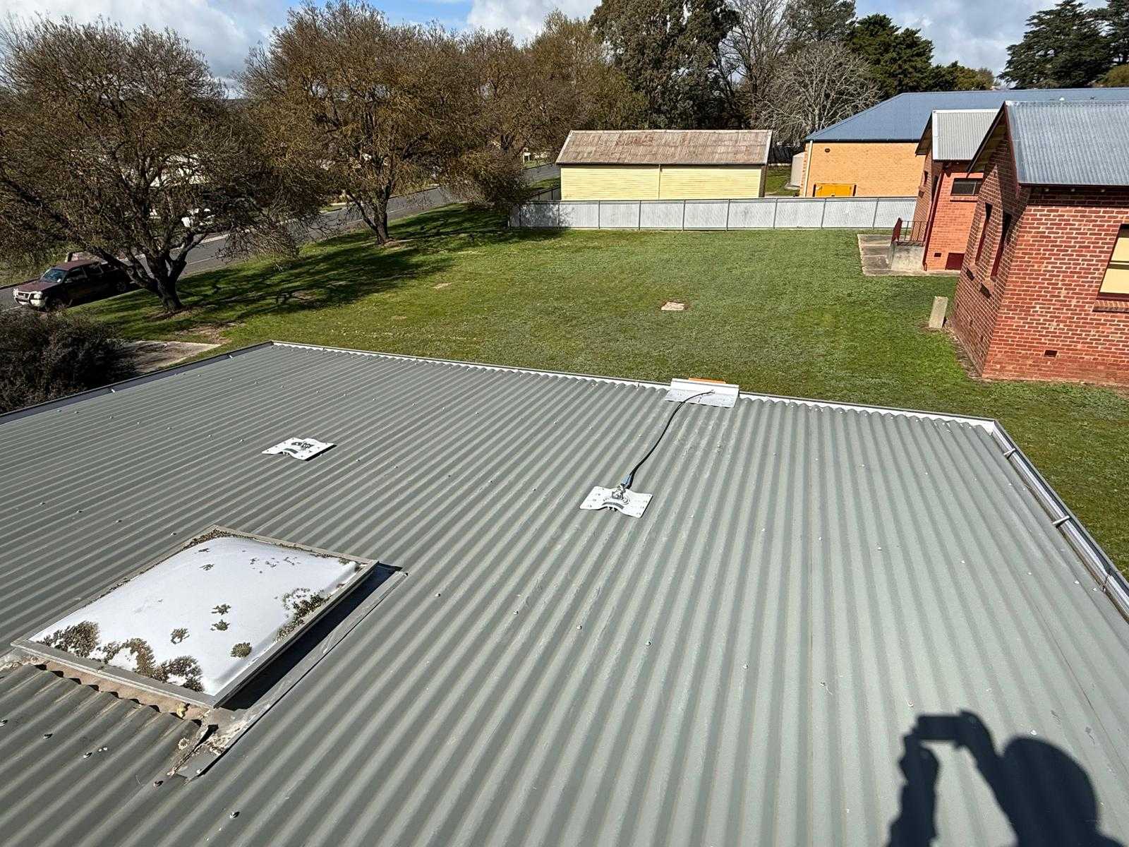 Roof anchor and static line system on a Melbourne commercial building due for annual recertification
